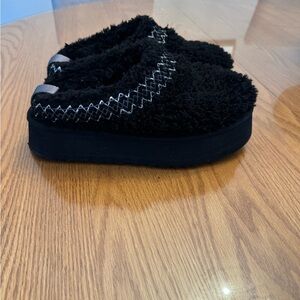 Ugg Taz platform slippers.